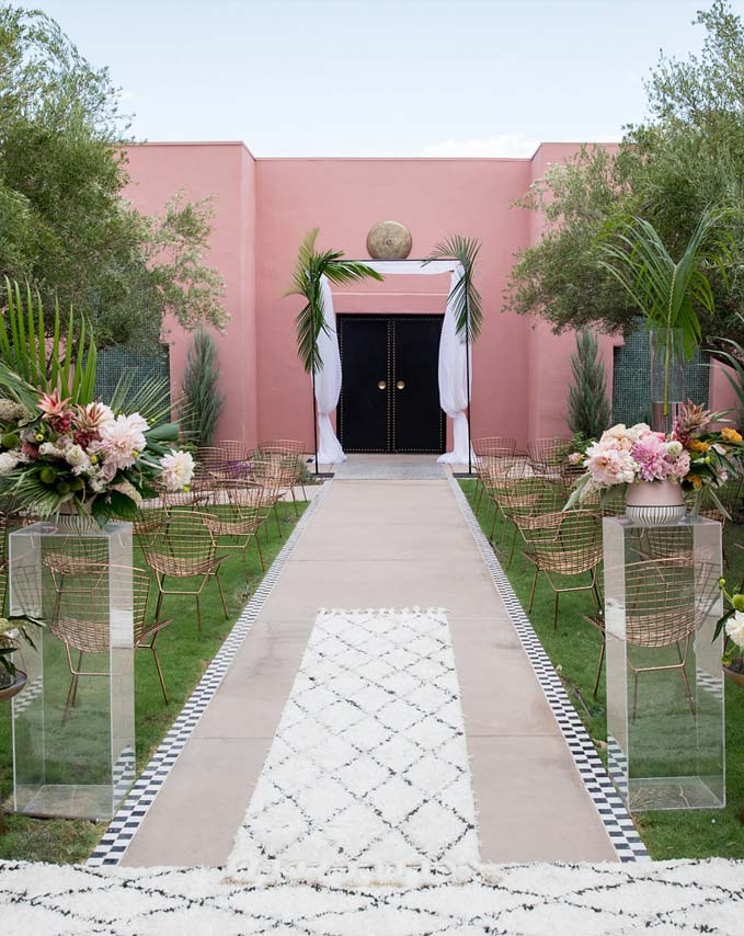 Outdoor wedding ceremony in the Olive Grove at the Sands Hotel & Spa, Indian Wells, with ancient olive trees and desert rose walls