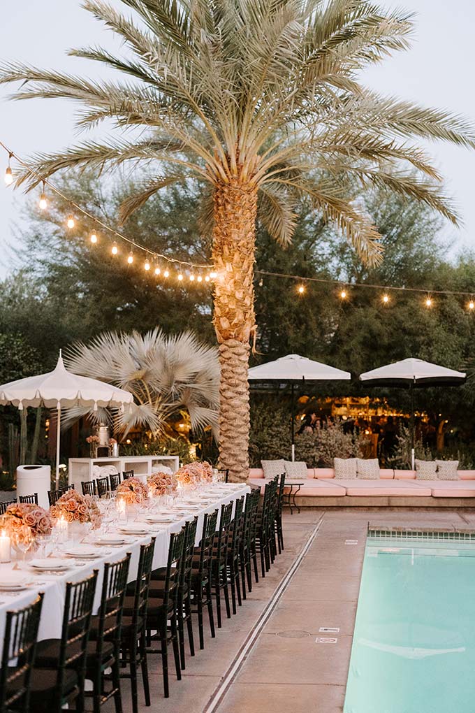 Elegant poolside wedding dinner at Sands Hotel & Spa, Indian Wells. Black and white striped cabanas with Moroccan-inspired décor
